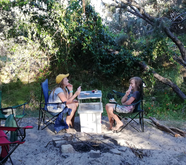 My sisters playing cards at the camp site